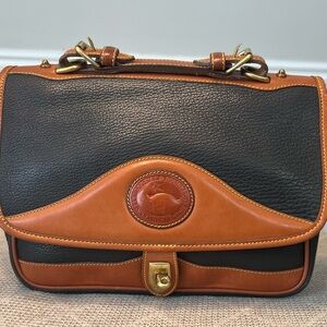 Dooney and Bourke Elegant Black and Tan Leather Shoulder Bag